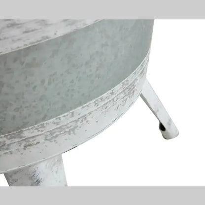 Rustic distressed metal accent table.